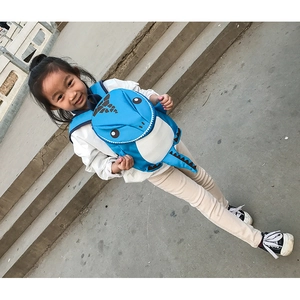 Blue dinosaur backpack with adjustable straps and serrated tail for kids' daily use