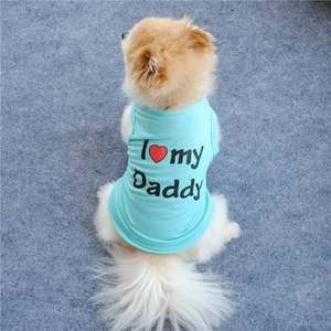 Detail of light blue cotton puppy vest featuring I Love My Daddy print on grey carpet