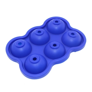 Detail view of blue 6-cavity silicone spherical ice ball mold for whiskey with fill holes