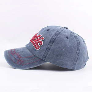 Vintage washed blue-grey cotton baseball cap with red 3D embroidery and side profile view