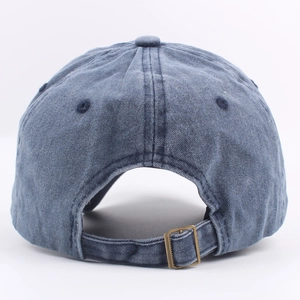 Back view of washed cotton baseball cap featuring vintage bronze metal adjustment buckle
