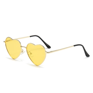 Fashion heart shaped sunglasses with gold metal frame and yellow tinted lenses for women