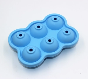 Detailed top view of a blue 6-cavity silicone spherical ice ball maker mold for drinks