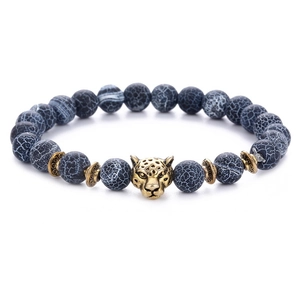 Detailed close-up of 8mm black weathered agate beads with bronze leopard head charm