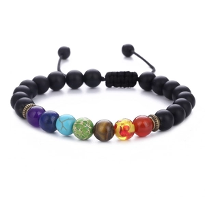 Detail of 7 chakra stones on adjustable braided black beads yoga energy bracelet