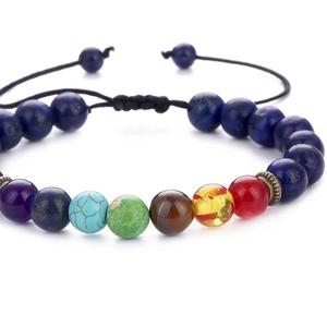 Detail of adjustable Seven Chakra braided bracelet with lapis and tiger eye natural stones