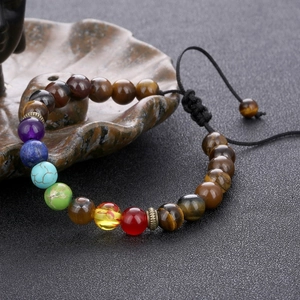 Macro detail of adjustable seven chakra beaded bracelet with natural healing stones