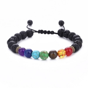 Detailed macro of 7 chakra natural stone beads with black lava rock on adjustable cord