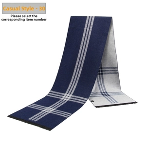 Detailed view of the double-sided jacquard weave and soft fringe of this winter scarf