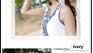 Detalle de blusa blanca crema con cuello en V, bordado azul marino y abalorios