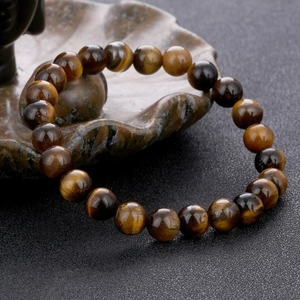 Ethnic yellow tiger eye stone bead bracelet with polished finish and cat eye effect