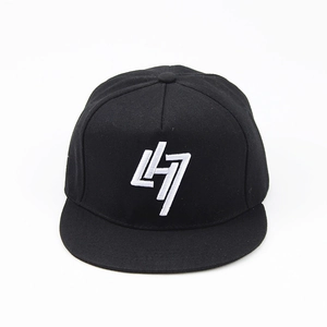 Macro shot of 3D white LH7 embroidery on black flat brim cotton snapback cap