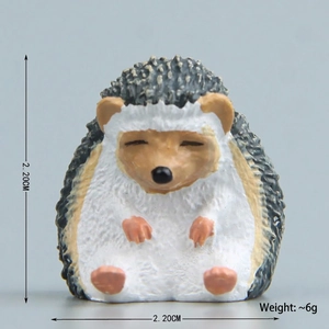 Close-up of sitting hedgehog figurine magnet with detailed 2.20cm size dimension