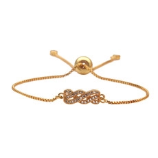 Detail of adjustable golden infinity knot bracelet with sparkling cubic zirconia crystals