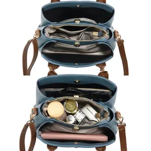 Vista dettagliata della borsa in pelle blu capiente con vari scomparti interni