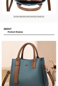 Borsa a tracolla blu in pelle con spazioso interno rosa e tracolla regolabile