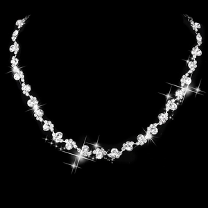 Macro shot of silver bridal necklace featuring sparkling rhinestones with starburst effect