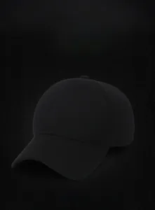 Detailed texture of black cotton twill baseball cap with matching adjustable top button