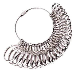 Silver metal ring sizer measuring tool set on white background for jewelry sizing