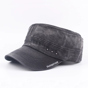 Washed black cotton flat top cadet cap with metal studs and vintage distressed finish