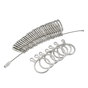 Silver metal ring sizer measuring tool set on wire rope for finger size measurement