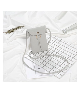 Detailed close-up of light grey lychee texture phone bag with tassel and gold ring