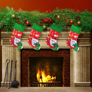 Christmas stockings set of four with Santa and reindeer patterns hanging on fireplace