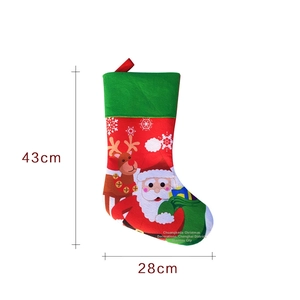 Christmas stocking decorations measuring 43cm by 28cm featuring Santa and reindeer motifs