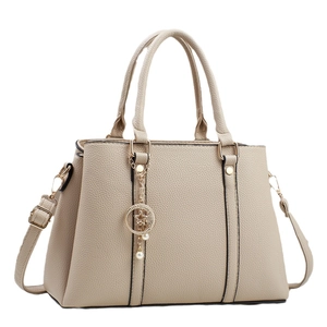 Large beige tote bag with star and moon charms and pearl detail for women