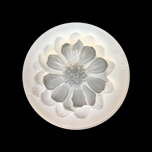 Top view of a translucent silicone mold with intricate daisy flower patterns for DIY resin