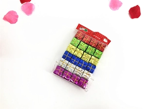 Close-up of colorful laser foam mini gift boxes in retail packaging for Christmas trees