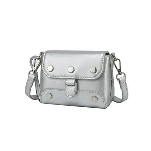 Detail of PU leather crossbody bag with silver butterfly buckle and internal structure view