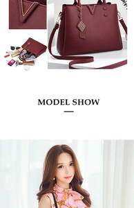 Spacious interior of burgundy lychee leather handbag showing tablet and accessories