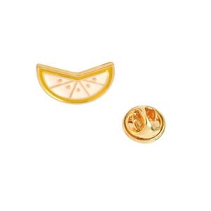 Golden enamel lapel pin shaped like a lemon slice with yellow and white detail