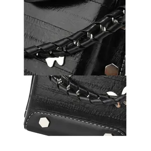 Detailed macro view of woven leather handle and metallic butterfly decoration on the bag