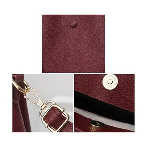 Detail of burgundy PU leather texture with detachable metal buckle and magnetic snap closure