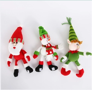 Detailed view of plush Santa, Snowman, and Elf Christmas dolls with long knitted legs
