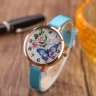Detail of blue PU strap and gold watch face with floral butterfly patterns