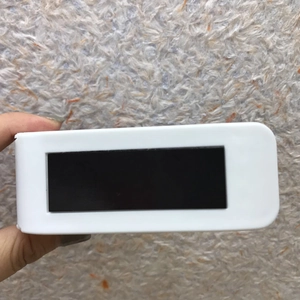 Handheld view of a mini white portable heat sealer for kitchen food bags and plastic storage