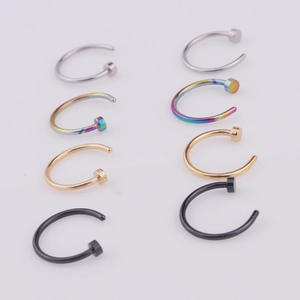 Detail of 316L stainless steel nose rings in silver, gold, black and rainbow finishes