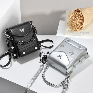 Minimalist square crossbody bag in black and silver leather with butterfly pendant