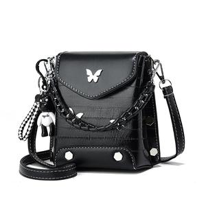 Minimalist black PU crossbody phone bag with silver butterfly emblem and metal studs