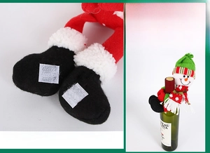 Detail of Christmas snowman wine bottle cover with secure velcro fastener design