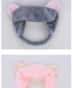 Detailed view of plush cat ear headbands in pink and grey soft fleece material