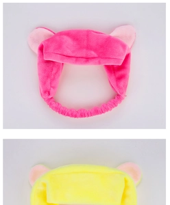 Detailed view of soft plush cat ear headbands in vibrant pink and yellow colors