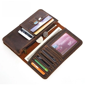Detail view of the interior slots and zipper pocket of this vintage dark brown leather wallet