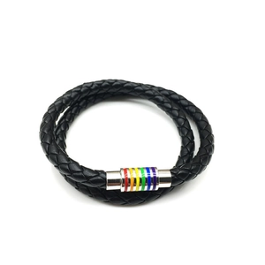 Close-up of black braided leather bracelet with rainbow striped magnetic clasp