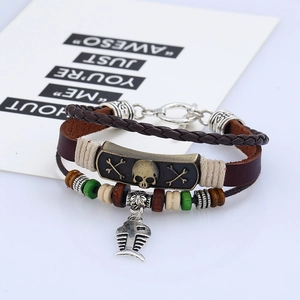 Vintage multilayer leather bracelet with skull motif and fishbone charm in punk style
