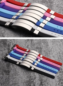 Detailed view of colorful silicone bracelets with polished silver curved metal ID plates