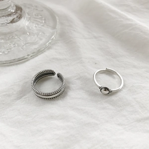 Macro shot of S925 sterling silver rings showing dot texture and ball detail